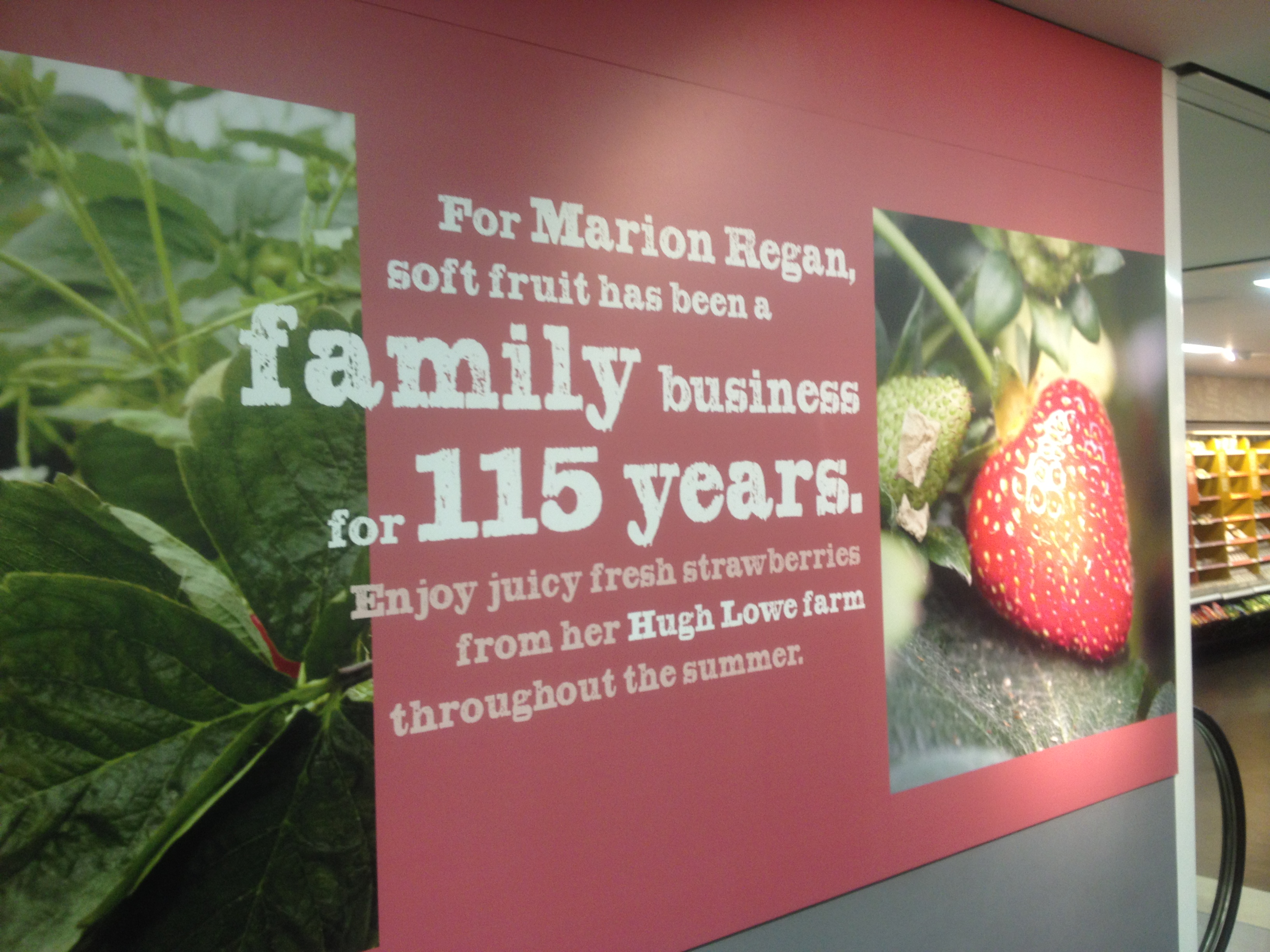 A photo of a Marks and Spencer poster featuring a strawberry