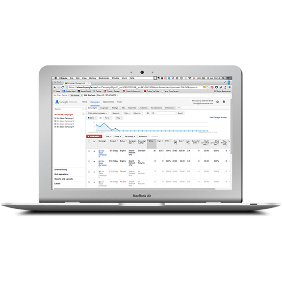 A MacBook laptop displaying the Client Manager interface of Google AdWords | Tribus Creative - marketing for small businesses