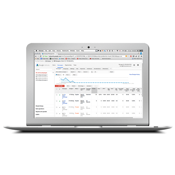 A MacBook laptop displaying the Client Manager interface of Google AdWords | Tribus Creative - marketing for small businesses